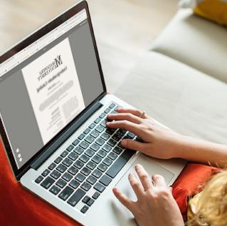 woman on laptop with Madonna University electronic document on the screen